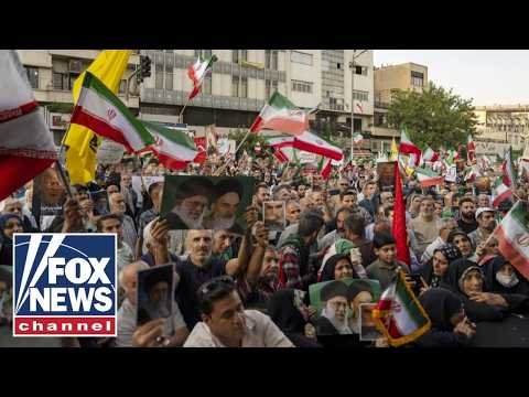 Iranians wave 'Down with USA' flags in streets of Tehran 1 Iranians wave 'Down with USA' flags in streets of Tehran