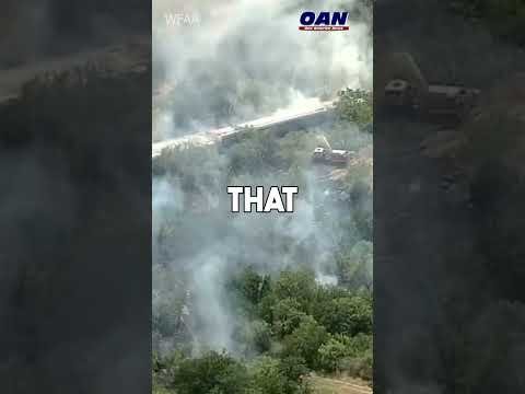 MASSIVE TRAIN DERAILMENT IN TEXAS. Thick smoke is pouring into the sky. Potentially hazardous.