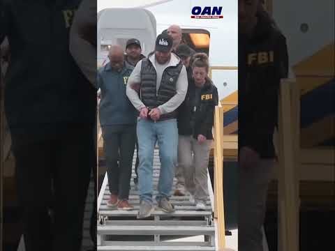 Ryan Wedding escorted by FBI agents