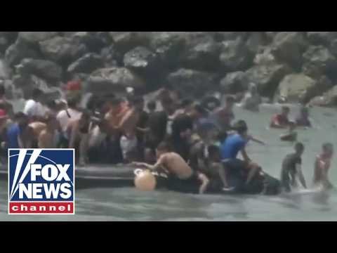 BREAKING: Migrants storm city border as national emergency requested 1 BREAKING: Migrants storm city border as national emergency requested